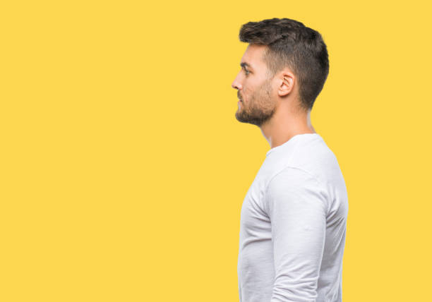 istock Young handsome man over isolated background looking to side, relax profile pose with natural face with confident smile. 1042816480