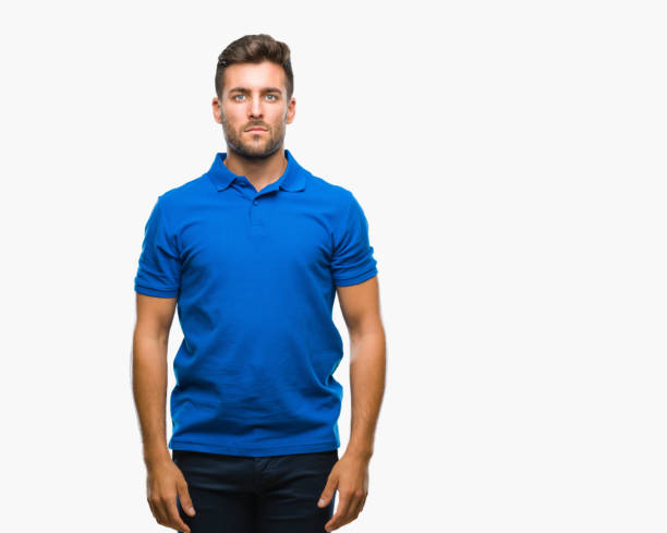 istock Young handsome man over isolated background with serious expression on face. Simple and natural looking at the camera. 1042816960