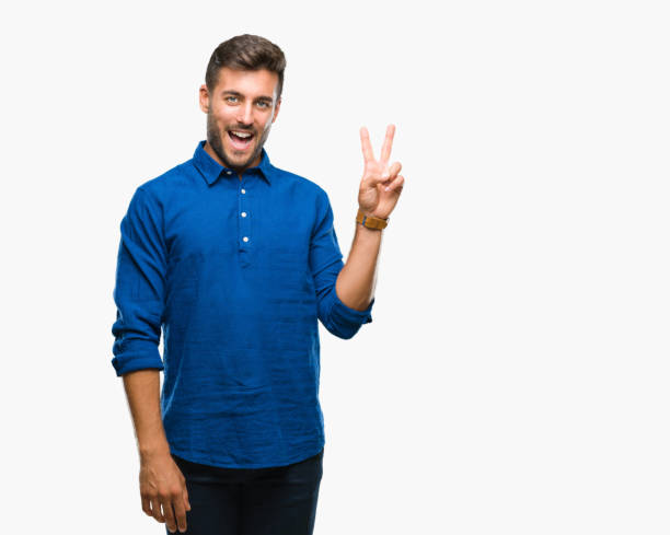 istock Young handsome man over isolated background smiling with happy face winking at the camera doing victory sign. Number two. 1042817064