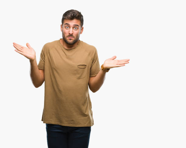istock Young handsome man over isolated background clueless and confused expression with arms and hands raised. Doubt concept. 1042817196
