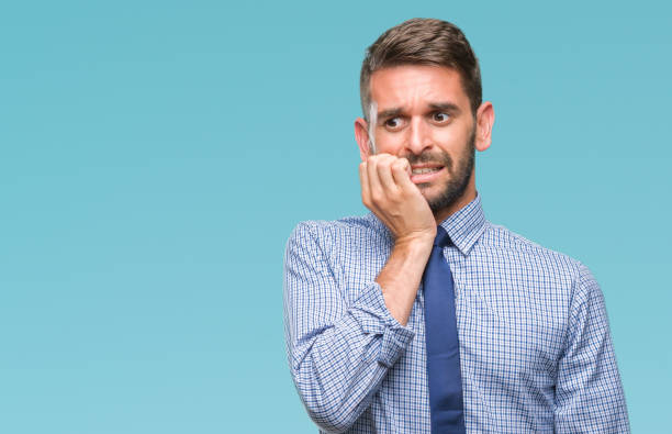 istock Young handsome business man over isolated background looking stressed and nervous with hands on mouth biting nails. Anxiety problem. 1042830352