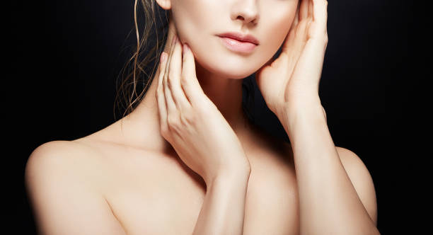 Lips, hands and shoulder, beauty part of model girl face with clean skin, natural nude make-up stock photo