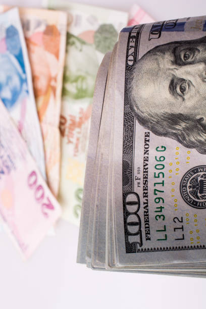istock American dollar banknotes and Turksh Lira banknotes side by side 1042835764