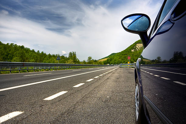 istock car on a road in the countryside 104284134