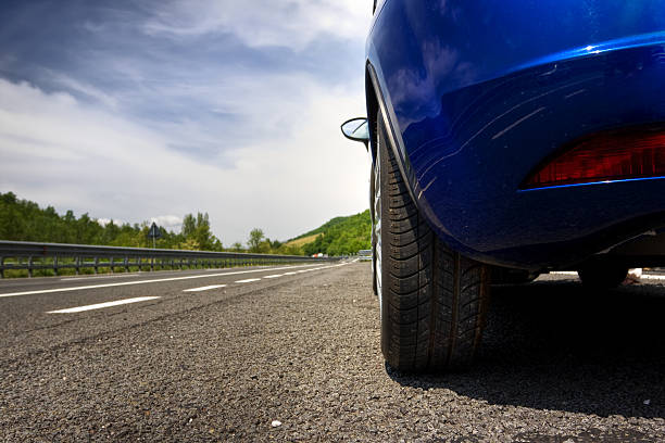 istock car on a road in the countryside 104284144
