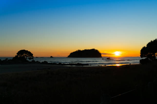 istock Golden sunrise over Mount Maunganui beach 1042846682