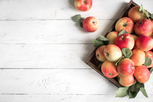 istock Red apples in wooden box 1042867696