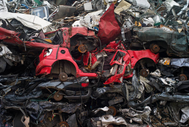 istock Scrapped Red Car in the Recycle Yard 1042872988