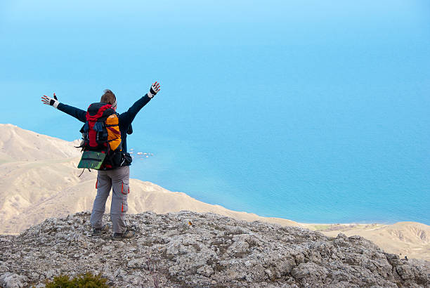 istock Hikers on a stony sea shore 104287544