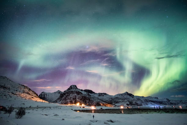 istock Aurora borealis (Northern lights) explosion with starry on mountain 1042891756