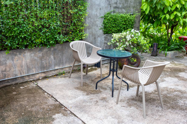 istock Glass table with chairs in garden 1042891836