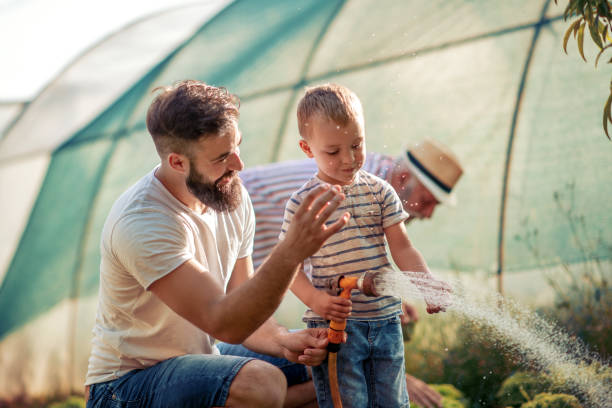 istock Young father with his son working in the garden 1042900270