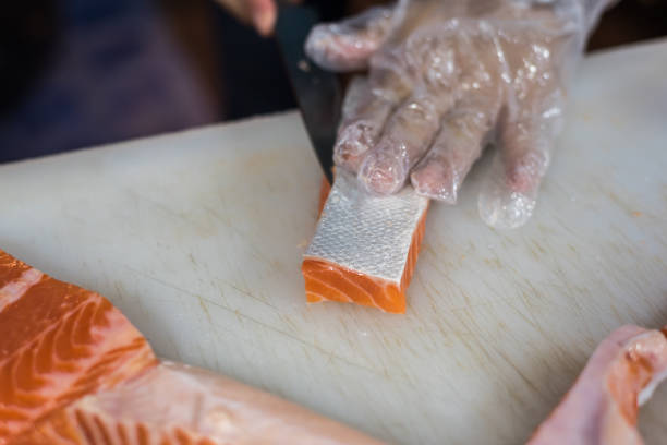 istock Asian chef slice japanese food sashimi salmon 1042904270