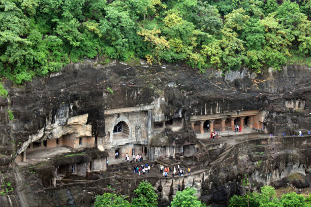 The view of Ajanta caves, the rock-cut Buddhist monuments The view of Ajanta caves, the rock-cut Buddhist monuments. Taken in India, August 2018. ajanta caves stock pictures, royalty-free photos & images