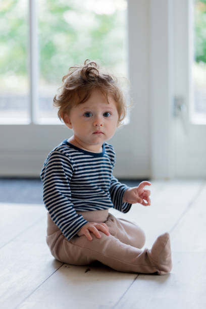 istock Little baby boy have a fun on a floor 1042913838