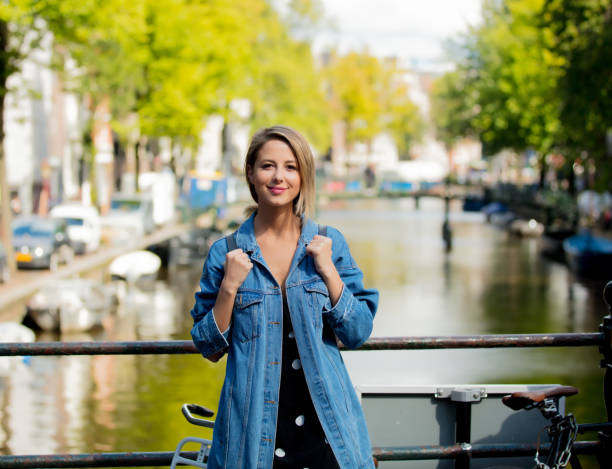 istock girl with backpack in Amsterdam 1042917574