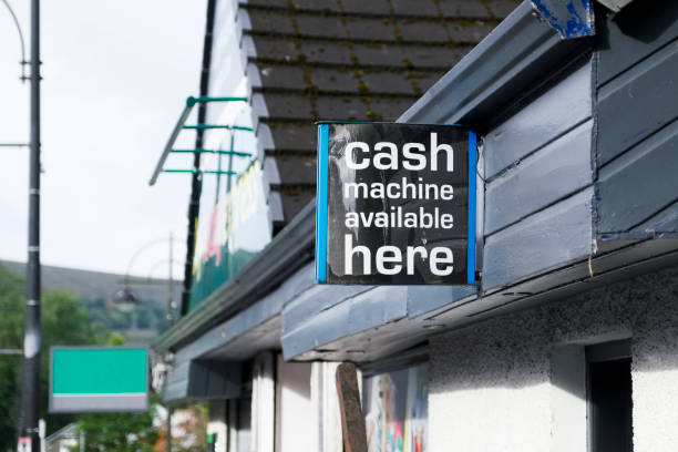 istock Cash machine here free withdrawals machine sign on wall 1042918086