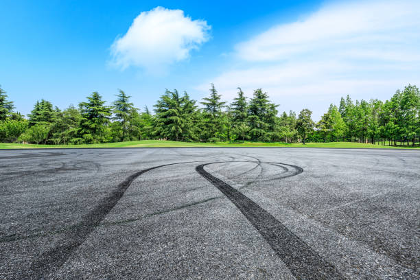 istock Asphalt race track and green forest natural landscape 1042918112