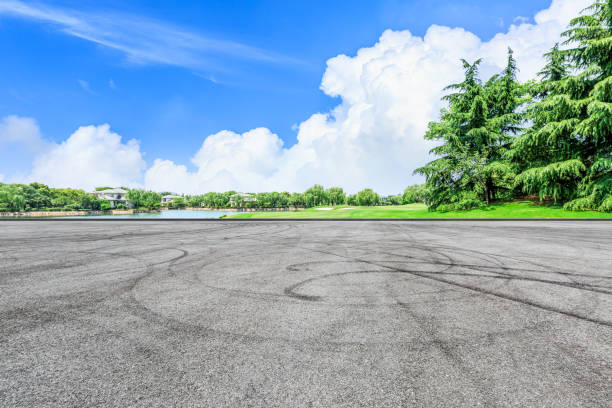 istock Asphalt race track and green forest natural landscape 1042918264