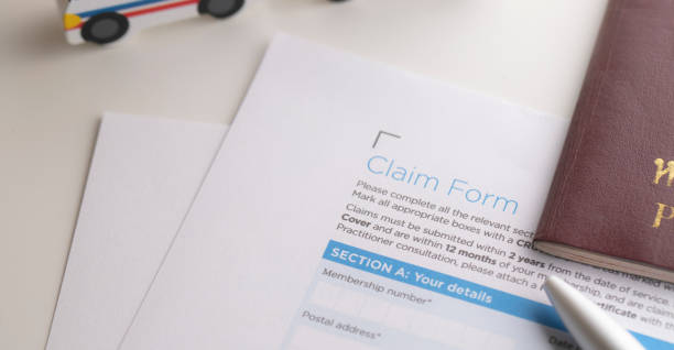 istock Insurance claim concept with pen and passport 1042918292