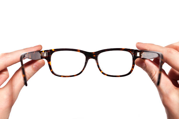 istock glasses with horn-rimmed in human hands isolated 104291991