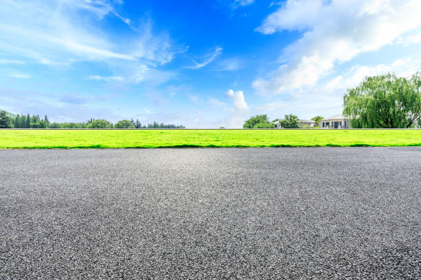 istock Asphalt road and green forest natural scenery 1042920518
