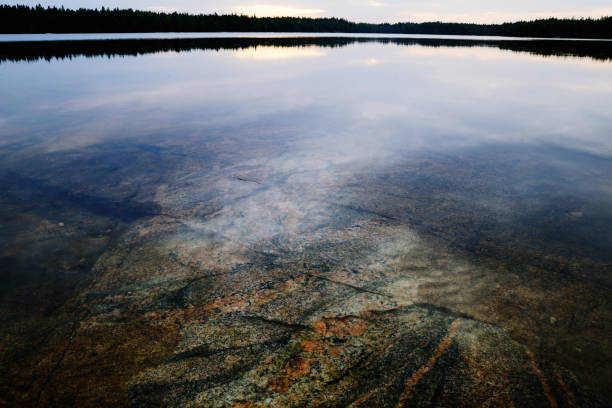 granite slab under the surface of the water, landscape stock photo