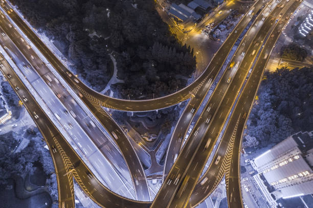istock aerial view of highway interchange at night 1042927104