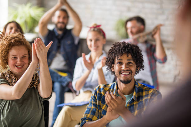 istock Happy creative people applauding on a seminar in the office. 1042932624