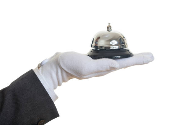 手袋をはめた手でバトラー サービス ベル - hotel occupation concierge bell service ストックフォトと画像