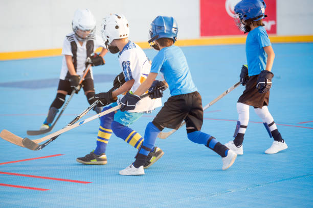 istock Team players having competitive hockey game 1042936086