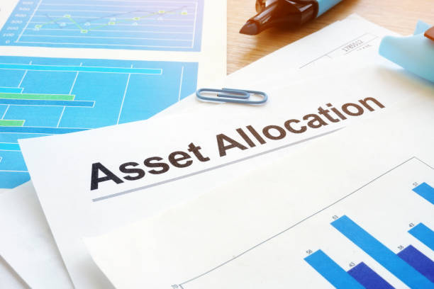 istock Asset allocation. Financial documents and pen on an office desk. 1042942444