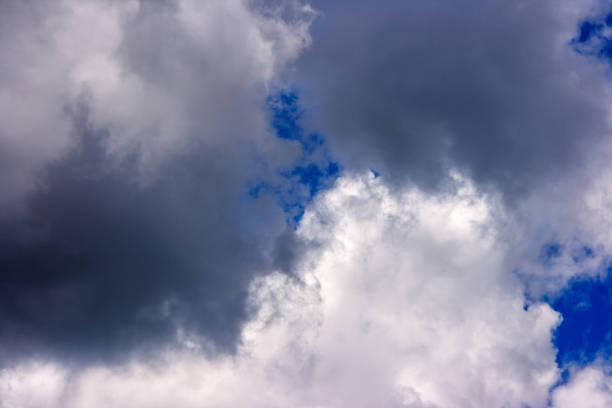 istock dense and great white clouds on a beautiful summer blue sky 1042942822