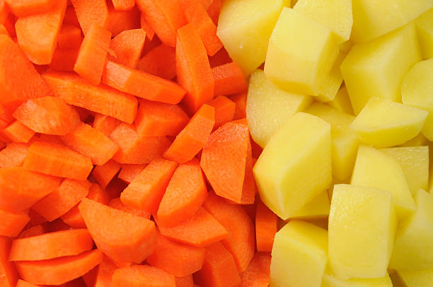 istock Slices of raw carrots and potatoes 104294461