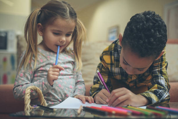 istock Little smart girl and boy. 1042947630