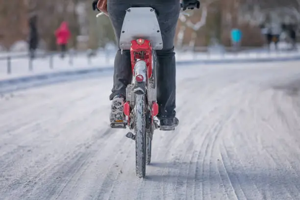 cycling on snowy street in winter