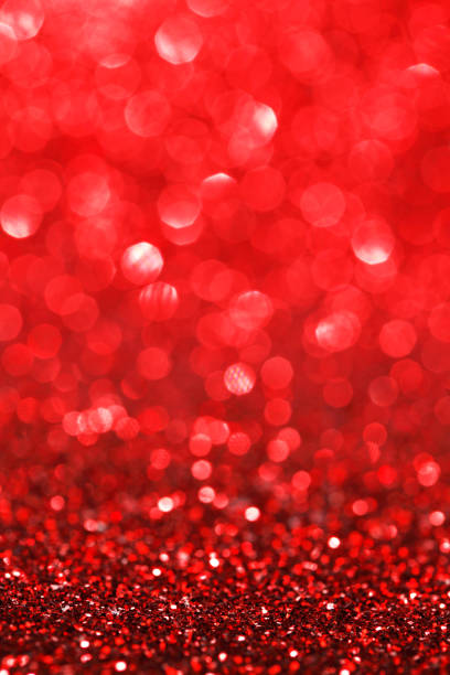 istock Red bokeh holiday textured glitter background 1042947834
