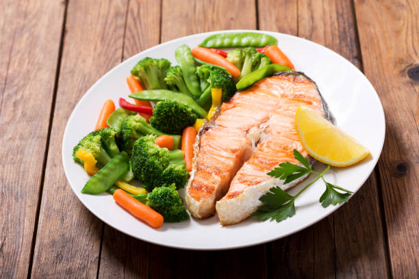 istock plate of grilled salmon steak with vegetables 1042948842
