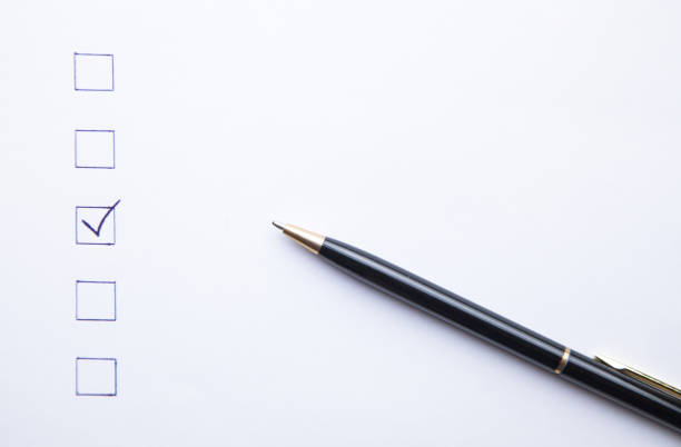 istock Pen and Checklist on white paper. Business concept 1042964360