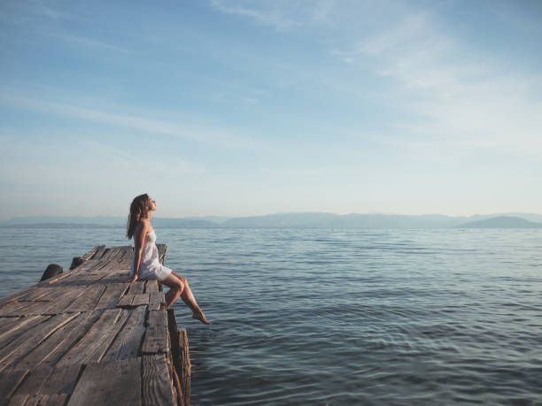istock Woman on a pier 1042971430