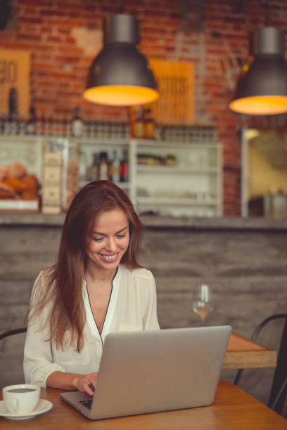 istock Working smiling girl with a laptop 1042971550