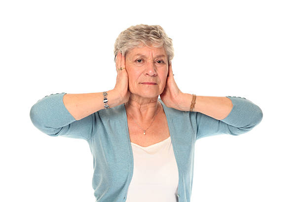 istock Senior older woman covering ears 104297402