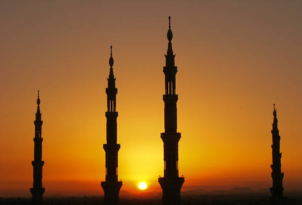 Silhouette of Nabawi mosque minarets, AL Madinah, Arabia Silhouette of minarets of Nabawi mosque, Medina, Saudi Arabia al madinah photos stock pictures, royalty-free photos & images
