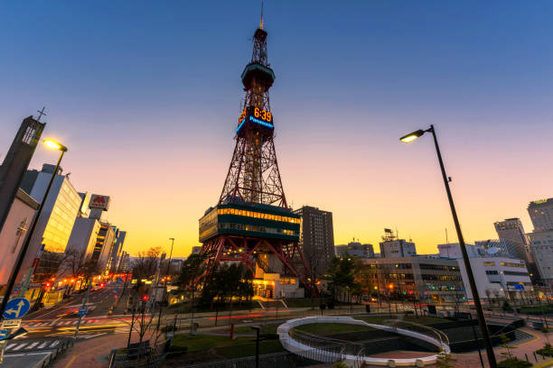 Sapporo, Japan - Apiril 24 2016: Sapporo TV Tower and city skyline at dusk near Odori Park. The 147.2 meter high tower has an observation deck open to tourists.