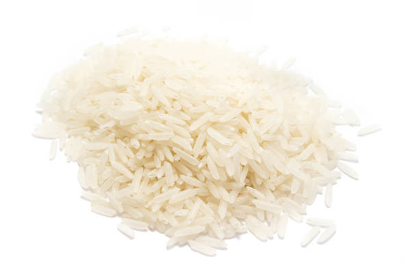 istock Pile of rice grains isolated isolated on white background 1042982370