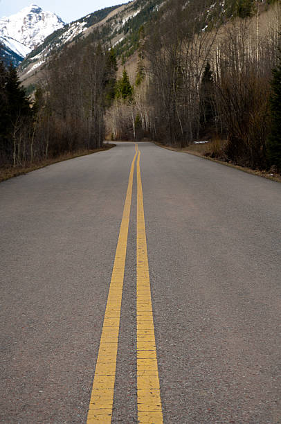 istock Road leading to a snow-capped mountain 104298488