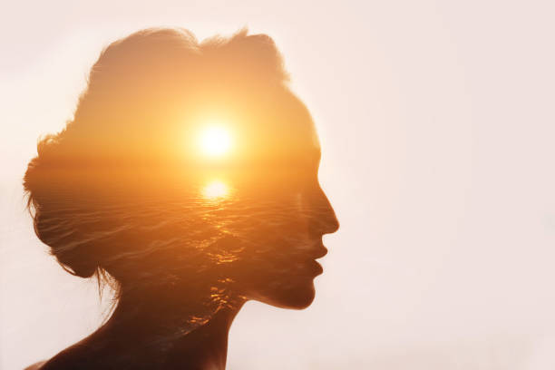Philosophy concept. Sunrise and woman silhouette. stock photo