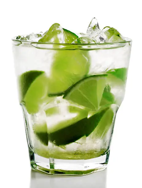 Photo of A cocktail with lime against a white background