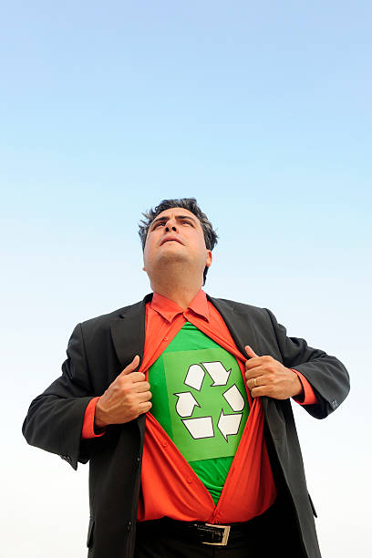istock proud to recycle: businessman is a recycling hero 104299408