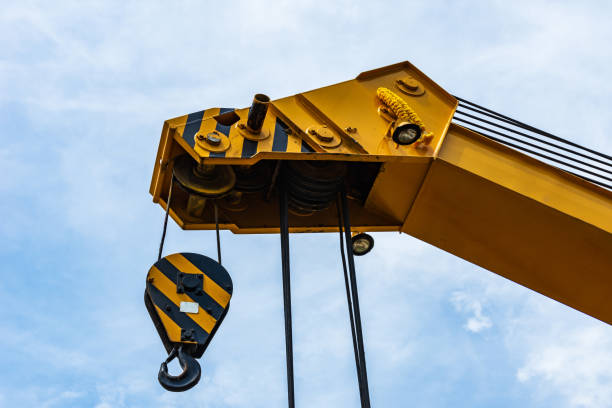 crane operator works. - pulley hook crane construction imagens e fotografias de stock
